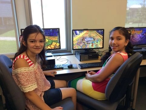 two campers at a computer