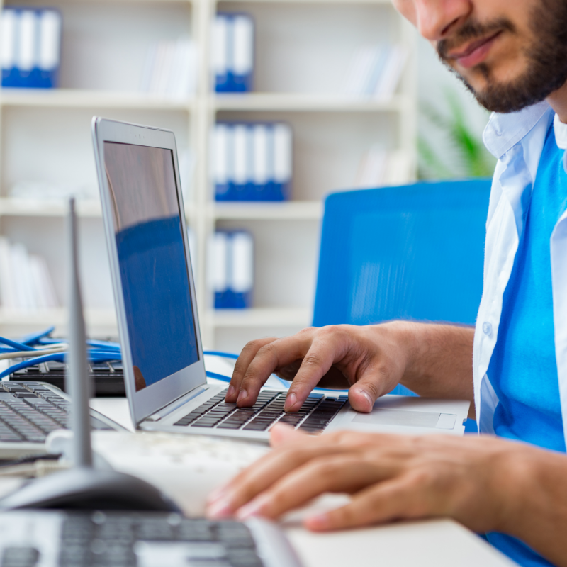 person typing on a laptop