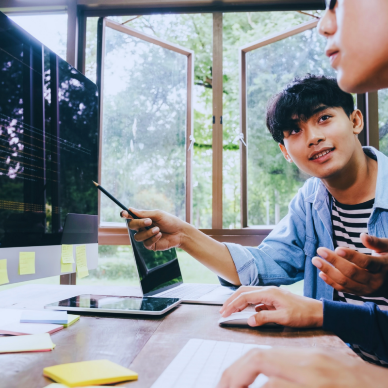 two students sitting at a computer