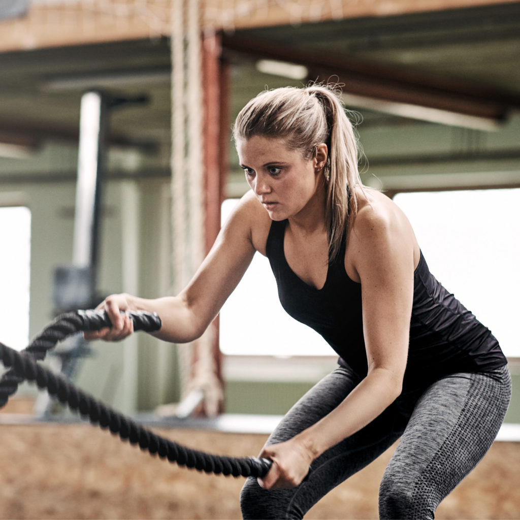 woman exercising with ropes