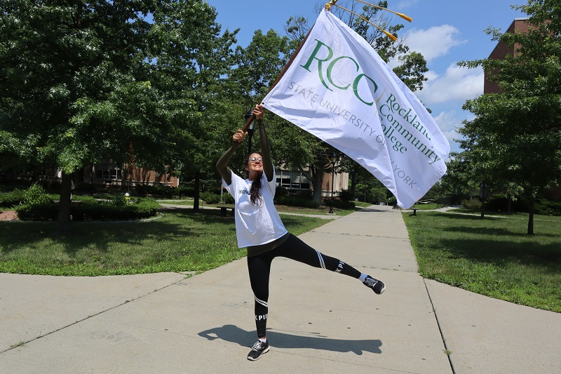 Student waving an RCC flag