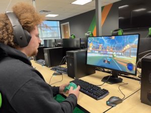 student playing Rocket League in eSports arena