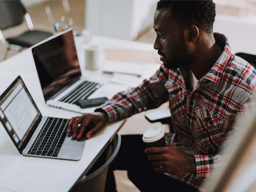 adult student looking at laptop