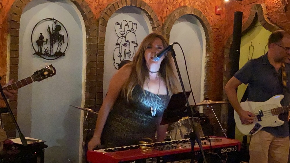 Rachel Kraushaar singing with band