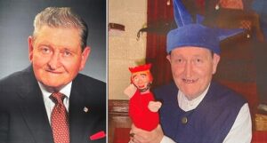 John Maloney in a suit and in a jester hat with a puppet