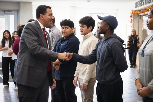 Chancellor King greeting students