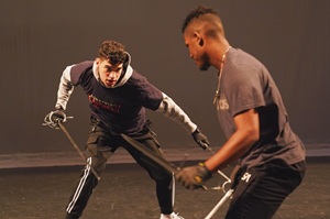 two students practicing stage combat