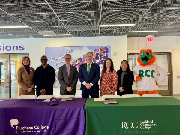 Purchase and RCC Presidents, Admissions, and Academic Affairs teams group shot with RCC Mascot.
