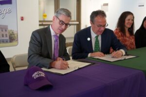 SUNY Purchase President Michael E. Steiper and RCC President William Mullaney signing agreement.