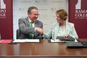 Rockland Community College President Dr. William Mullaney and Rampapo College President Dr. Cindy Jebb shake hands after signing Transfer Agreement.